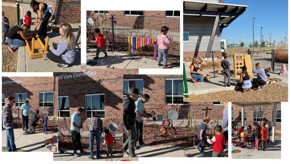 Children and adults engage in music and play activities outside an elementary school on a sunny day.