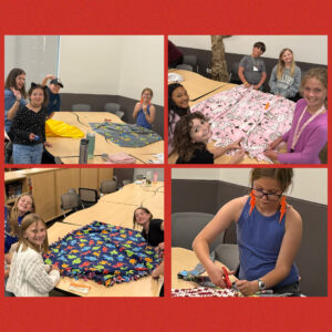 Children engage in a crafting session, making blankets with colorful fabrics at a table in a bright room.